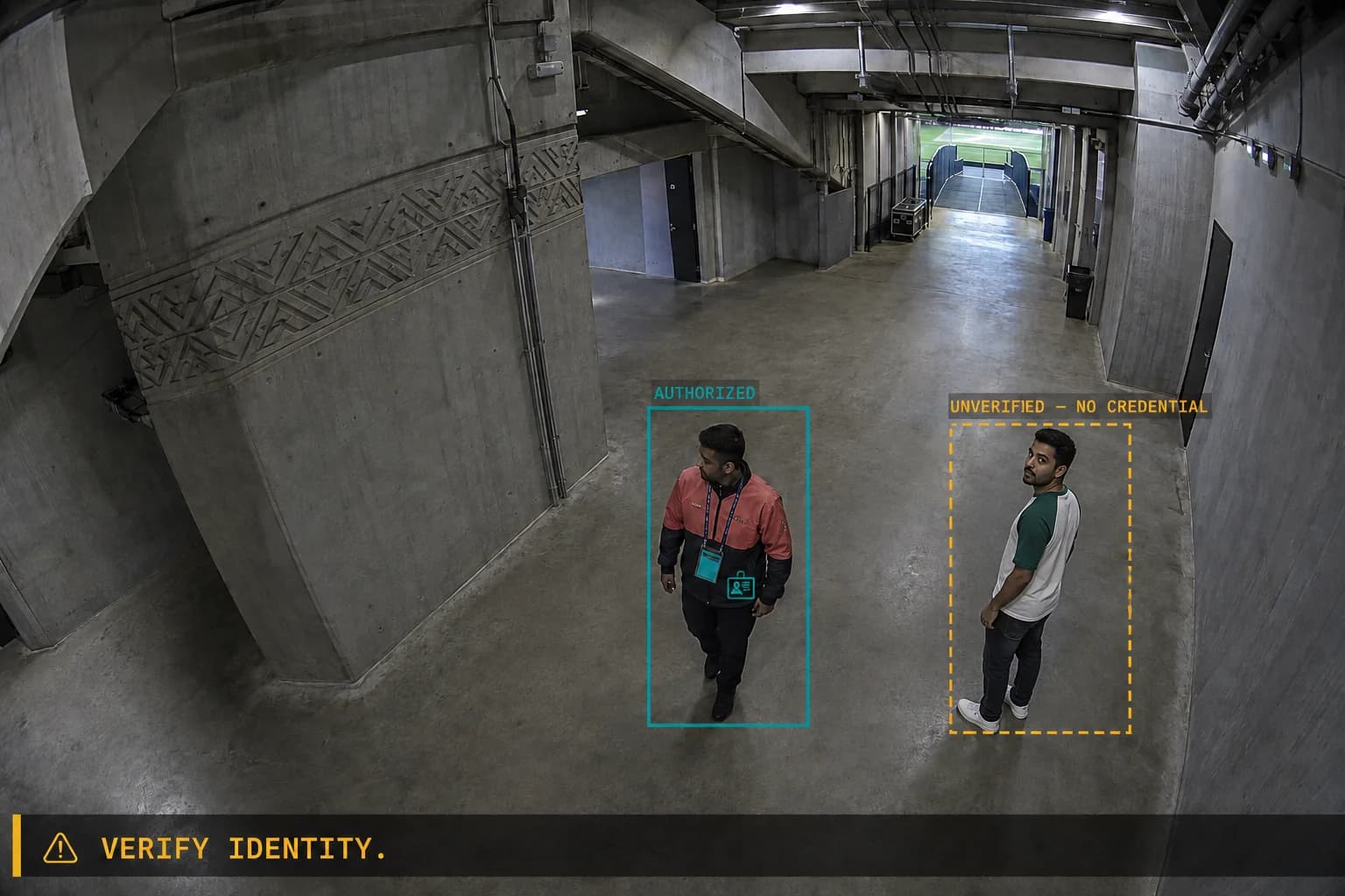 Restricted stadium corridor. One person wearing a credential is marked authorized; a second, without one, is flagged unverified and held for an identity check.